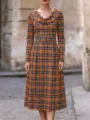 Detailed view of elegant women's orange plaid long sleeve dress with cozy cowl neck. - S / Orange