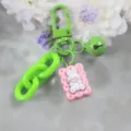 Cute resin rabbit biscuit keychain with green chain, stylish and playful bag charm accessory. - Style 6