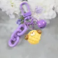 Cute purple cartoon keychain with yellow biscuit animal pendant for stylish bag charms and keys. - Style 14