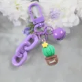 Violetter Kaktus Schlüsselanhänger mit Glocke und Harz Anhänger, süßer Taschenschmuck. - Kaktus Schlüsselanhänger (Stil 12)