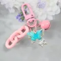 Portachiavi rosa elegante con ciondolo a farfalla in cristallo 3d e campanella per borsa. - Stile 7