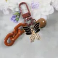 Brown butterfly keychain with rhinestone crystal details, metal clasp and cute decorative bell. - Style 8