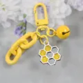 Yellow honeycomb keychain with bell and chain, cute candy color cartoon pendant for bags. - Style 1