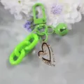 Green keychain with rhinestone double heart pendant, stylish accessory for keys and bags. - Style 18