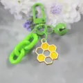 Green honeycomb keychain with cute bell and candy color pendant, versatile daily item. - Style 8