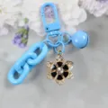 Cute blue alloy flower keychain with rhinestone and bell charm, stylish bag pendant accessory. - Style 19