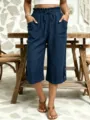Detailed view of women's casual loose dark blue cotton linen cropped trousers with elastic waist. - S / Burgundy