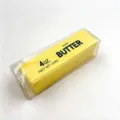 Nahaufnahme von langsam zurückfederndem Butter-Stressspielzeug in Klarsichtbox - 小号黄色款