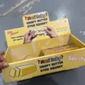 Yellow display box featuring Musi Baby crispy butter stick squishy toys for stress relief - 12 Pieces/Pack / Crispy Squishies Box of 12 [Custom Colors Available]
