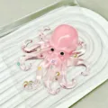 Pink octopus squishy toy with pearl and star decorations in packaging - Octopus / Transparent Pink