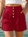 High-waisted red shorts with front buttons and pockets for casual summer beach wear women. - S / Red