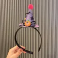 Kids Halloween witch hat headband with sparkly glitter pumpkin and cute plush pom pom design. - Wizard Hat Headband / Purple