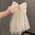 Kids fairy mesh bow hair clip with cute floral embroidery and long veil ribbon for girls. - 1-2 Pieces / Champagne