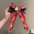 Christmas bow hair clip with Santa and reindeer print, red and green festive hair accessory - Snap Clip / Magenta