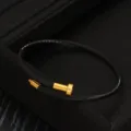 Edelstahl Draht Armband für Damen und Herren, modisches gedrehtes Design Schmuckstück. - Schwarz Und Gold