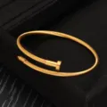 Edelstahl Draht Nagel Armband für Damen und Herren, stilvoller goldener Modeschmuck Bangle. - Gold