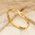 Bracciale rigido in acciaio titanio dorato motivo foglia gioielli di lusso vista principale - Oro Infinito