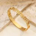 Bracciale rigido geometrico in acciaio inossidabile dorato motivo greco variante - Design Motivo Greco Oro