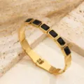 Bracciale rigido in acciaio inossidabile dorato con zirconi rettangolari neri variante - Zircone Nero