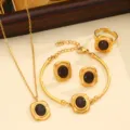 Elegant stainless steel gold-plated jewelry set featuring necklace bracelet and earrings. - Style 05 / Black