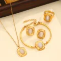 Gold stainless steel jewelry set featuring necklace, bracelet, earrings, ring with cat eye stones. - Style 05 / White