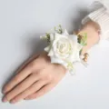 Elegant white artificial rose wrist corsage with gold berries, perfect for wedding bridal party. - White Wrist Flower