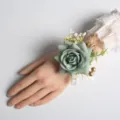 Sage green artificial rose wrist corsage with gold beads and white flowers for wedding party. - Green Wrist Flower