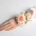 Elegant artificial rose wrist corsage for wedding bridal party and special evening events. - Champagne Heart Wrist Flower
