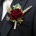 Burgundy artificial rose boutonnière for wedding groom suit, elegant floral lapel pin accessory. - Wine Red Corsage