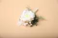 Elegant white rose boutonniere with pearls and pink ribbon for wedding wrist flower decor. - Wrist Corsage / White