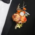 Orange artificial flower boutonniere for groom wedding lapel pin suit clothing accessory. - Style E Boutonnieres
