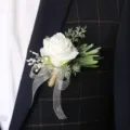 Elegant white artificial rose boutonnière with ribbon for wedding groom suit decoration. - White Dried Baby's Breath Boutonniere