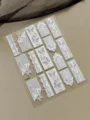 White lace butterfly nail art stickers with 3D relief hollow mesh patterns for manicure design. - Embossed Style (YT8854)