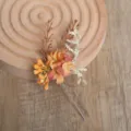 Rustic floral hair pin with artificial daisies and berries, perfect for bridal updos and events. - Letter G