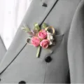 Elegant wedding boutonniere with pink roses and green leaves for groom and best man decoration. - Corsage / Deep Pink