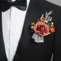 Elegant wedding artificial rose boutonniere for groom, groomsmen, and business celebrations. - Caramel Boutonniere