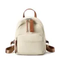 Zaino donna in pelle beige compatto con dettagli marroni, elegante borsa casual da giorno. - Bianco avorio