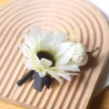 White sunflower boutonniere with black ribbon and mini pumpkin for holiday party costume. - Style C