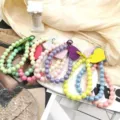 Colorful beaded phone lanyard details, cute heart charm phone chain set, decorative accessory display. - Multicolor