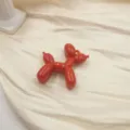 Red acrylic balloon dog charm detail shot, perfect for DIY keychains and cute phone cases. - Red