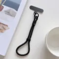 Courroie de poignet pour telephone portable en nylon noir avec laniere detail pratique. - Noir Avec Patch