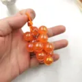 Acrylic AB color grape keychain pendant, vibrant orange shiny fruit charm for car keys and bags. - Orange Grapes
