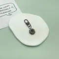Cute chocolate donut keychain with colorful sprinkles, metal clasp bag pendant accessory. - Black Donut