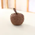 Detailed view of the brown straw woven pumpkin ball ornament, perfect for rustic festival decor. - Dark Coffee Paper Braid Pumpkin, 10 cm