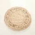 Close up view of natural corn husk woven placemat showing intricate handmade braided details. - 38cm Floral Wreath (Single Layer)