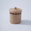 Close-up of a handmade woven storage basket with lid, perfect for desktop and home organization. - Style 3
