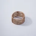 Detailed view of the handmade woven plant pot cover, natural straw storage basket design. - Style 2