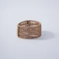 Close-up detail of hand-woven water hyacinth plant pot protector, natural straw basket ornament. - Style 1