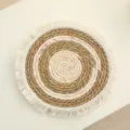Handmade woven round placemat with fringe texture natural straw table mat for home decor detail view - 20cm Bulrush and Corn Husk Rope Mat with Tassels