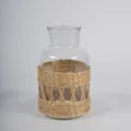 Close-up detail of the clear glass vase featuring hand-woven natural straw outer sleeve. - Bulrush Root Flower Vase Top 10 Bottom 14 Height 26